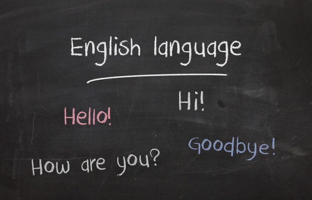 黒板に「English language」「Hello」「How are you?」などの基礎フレーズが書かれたイラスト